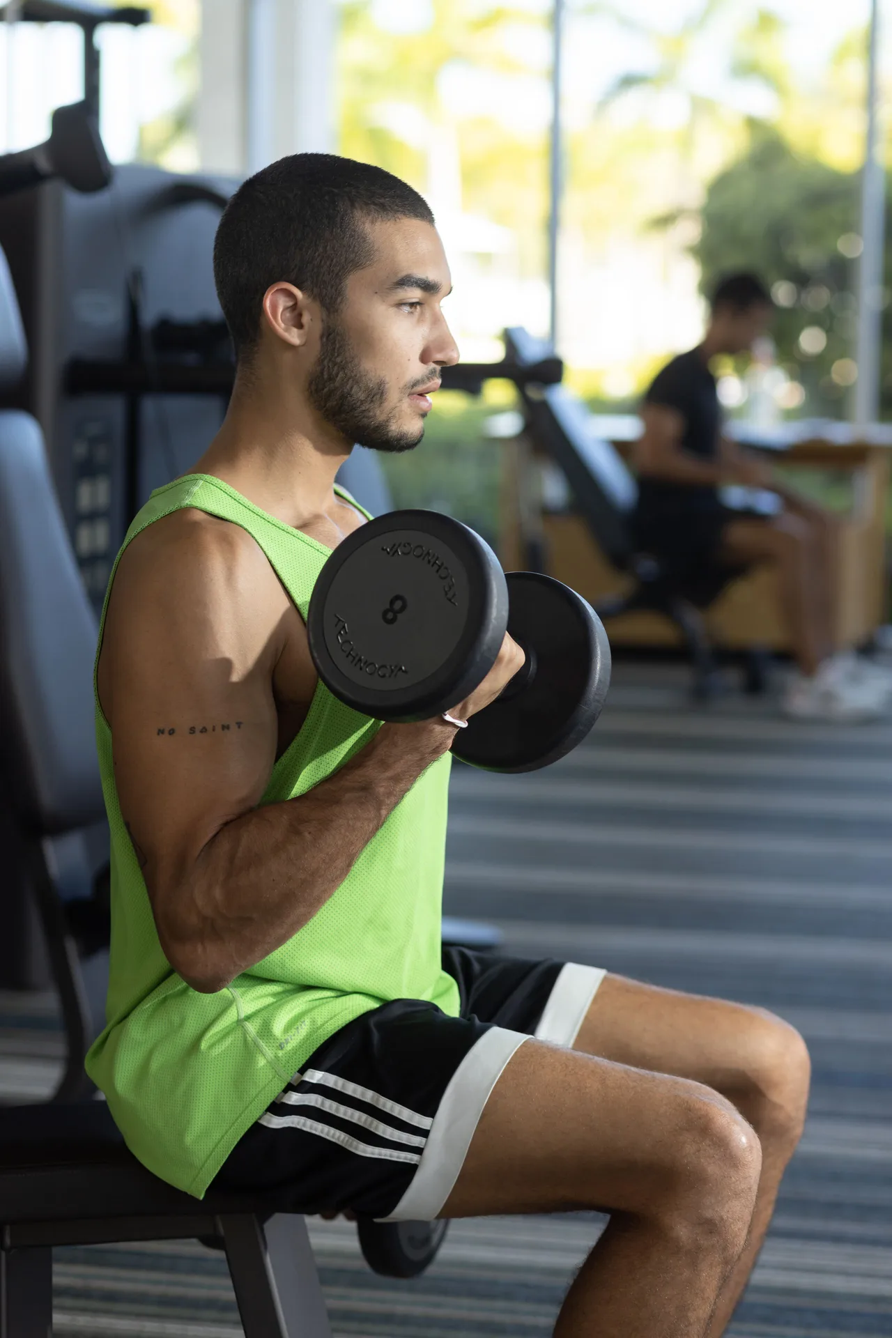 A guest lifts dumbbells in the fitness center at Paradisus Grand Cana.
