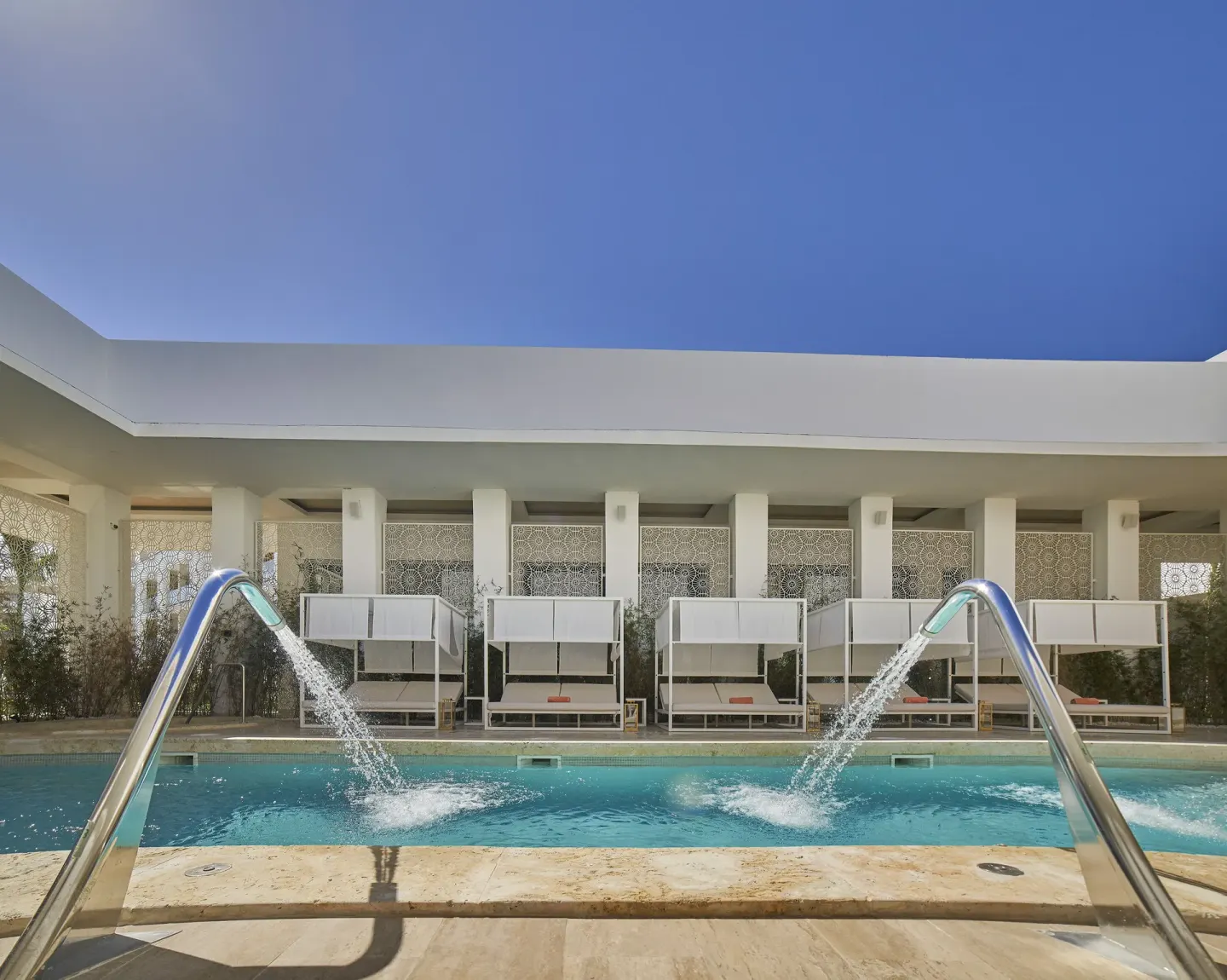 Pool water features pour into a spa-style pool at Paradisus Grand Cana.