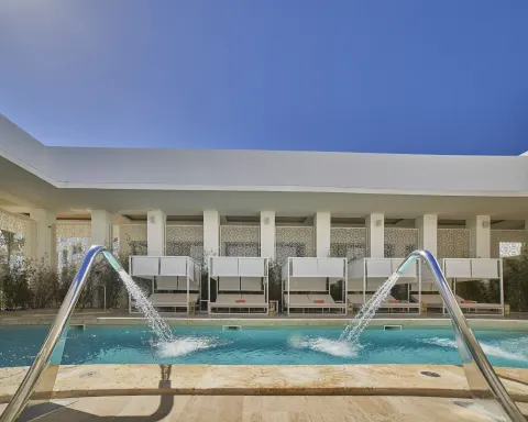 Pool water features pour into a spa-style pool at Paradisus Grand Cana.