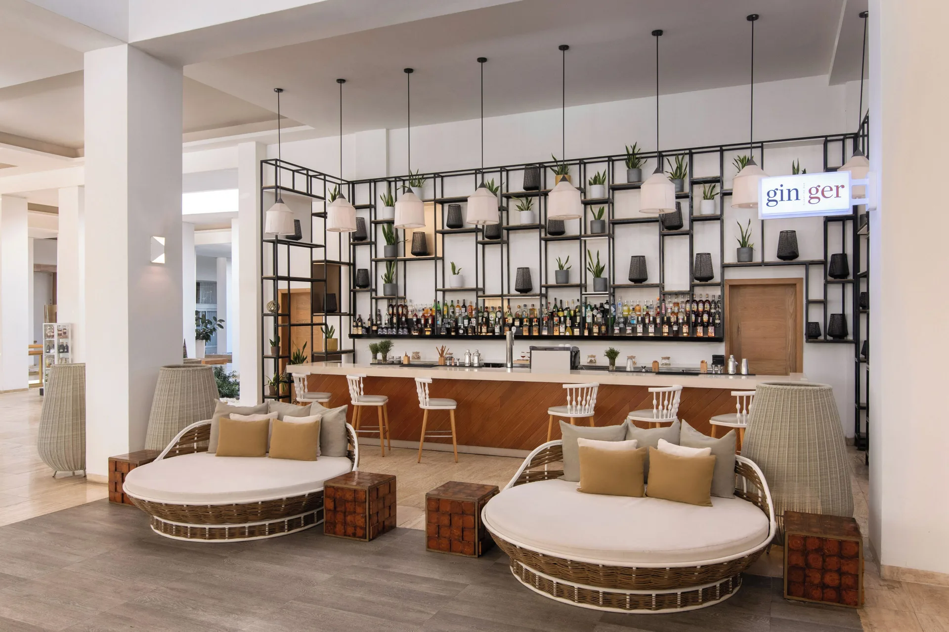 Ginger cocktail bar with cushioned daybeds at Paradisus Grand Cana.