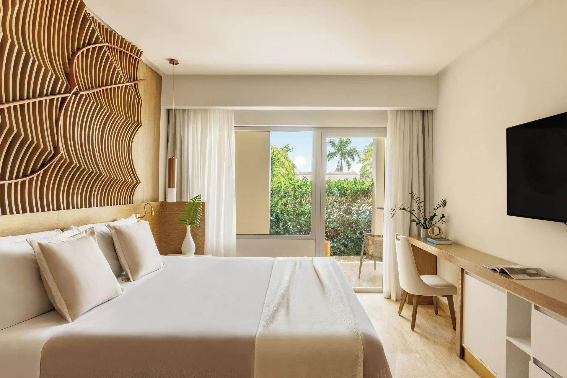 Beyond Two Bedroom Master Swim Up Suite bedroom with king bed at Paradisus Grand Cana.
