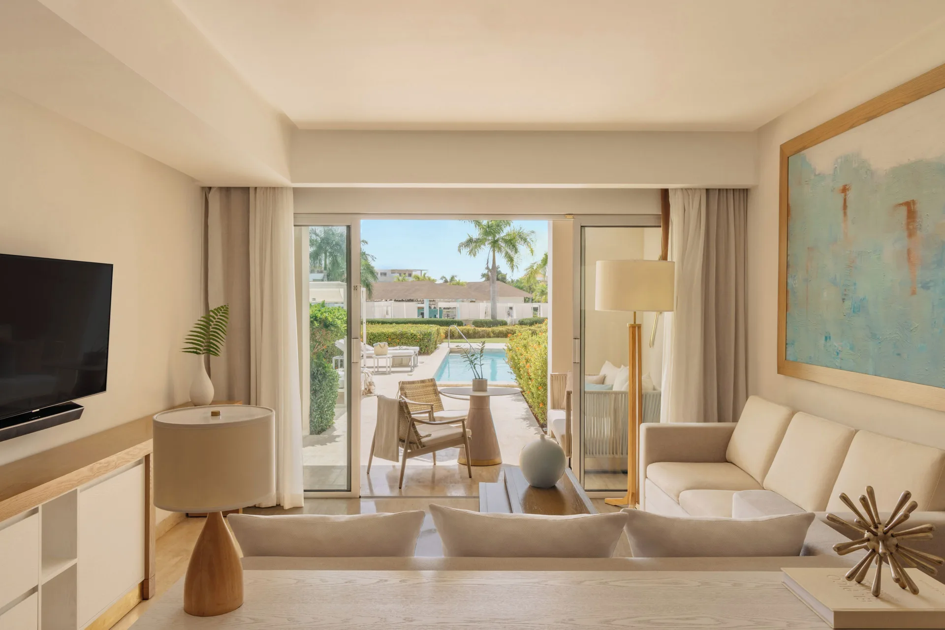 Beyond Two Bedroom Master Swim Up Suite living room with terrace and swim-up pool at Paradisus Grand Cana.
