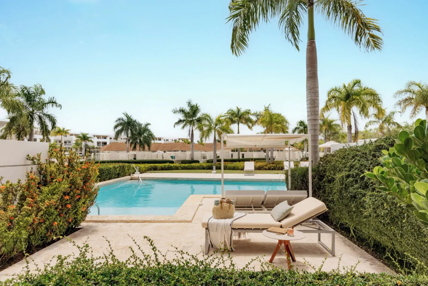 Swim-up suite patio with loungers and pool at Paradisus Grand Cana.