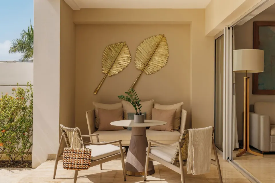Beyond Two Bedroom Master Swim Up Suite terrace seating with leaf wall decor at Paradisus Grand Cana.