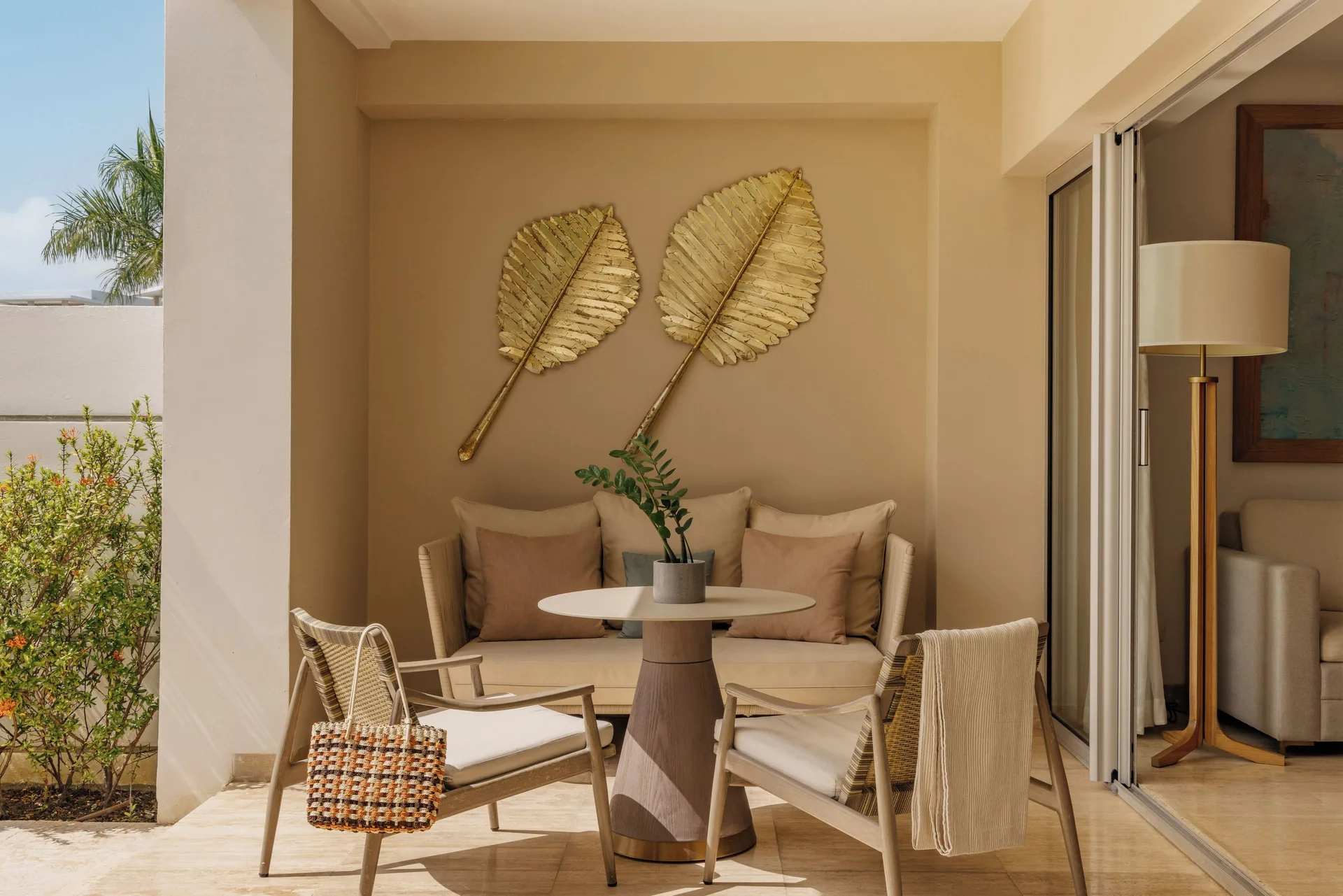 Beyond Two Bedroom Master Swim Up Suite terrace seating with leaf wall decor at Paradisus Grand Cana.