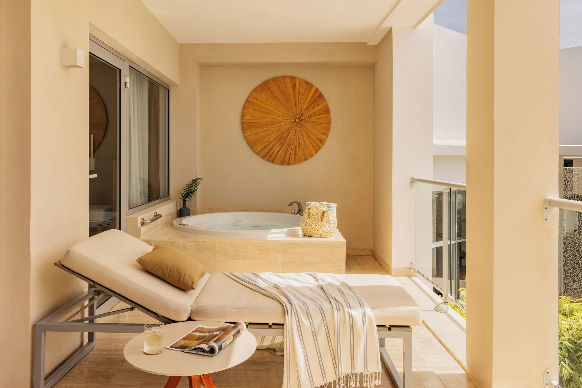 Covered balcony with whirlpool tub and chaise in the Family Concierge Master Suite at Paradisus Grand Cana.
