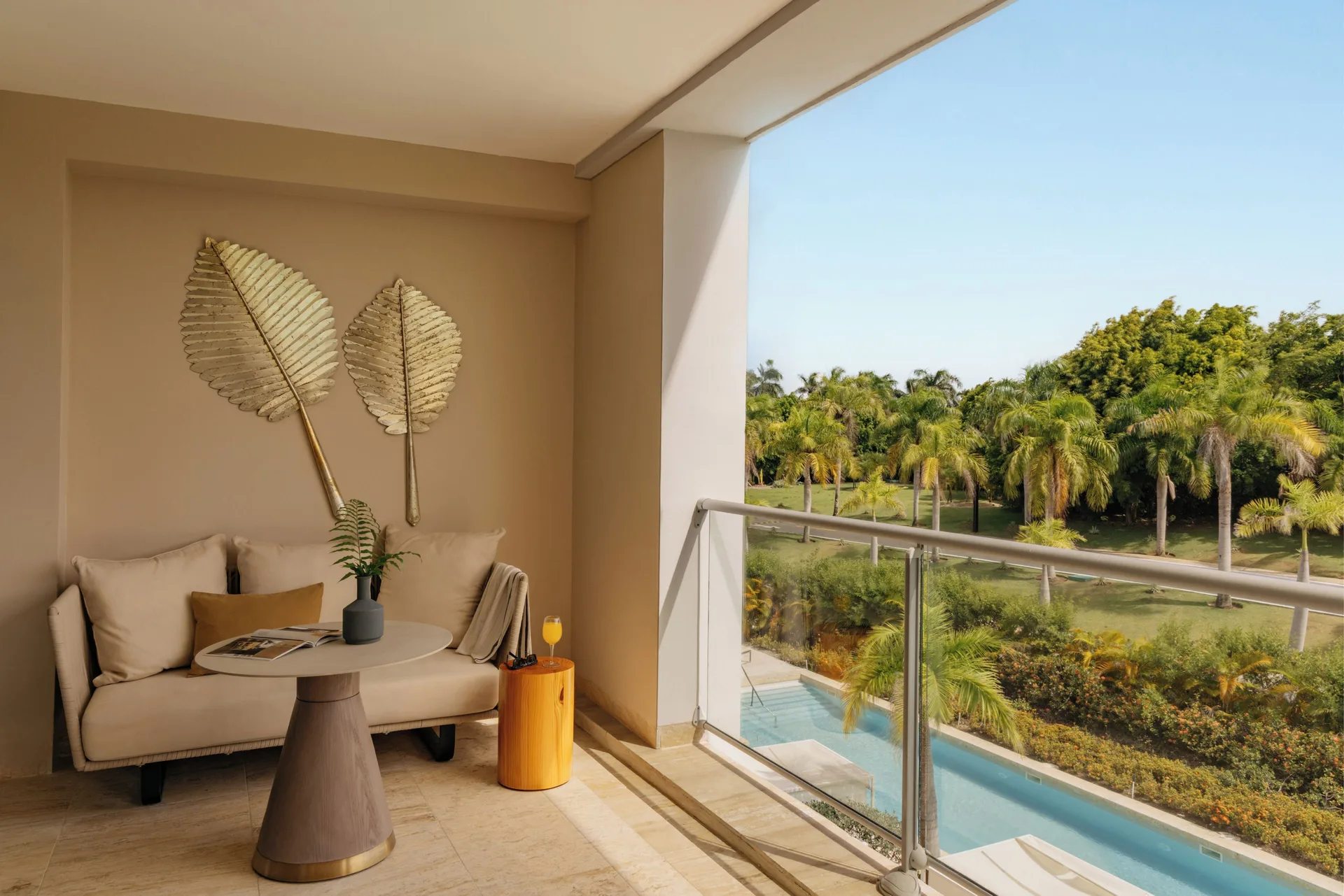 Balcony seating with palm views in the Family Concierge Master Suite at Paradisus Grand Cana.