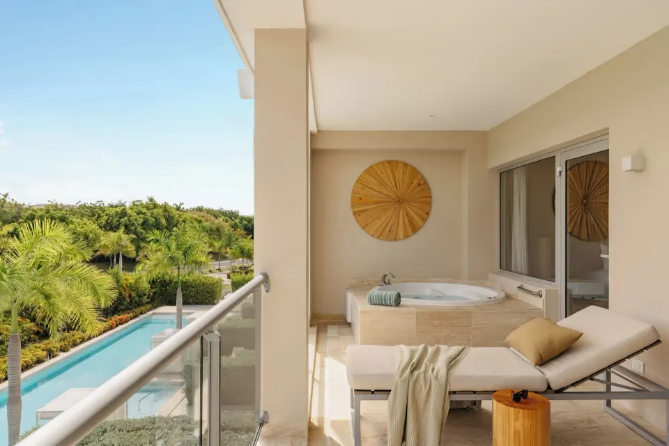 Balcony with whirlpool tub and lounger in the Family Concierge Master Suite at Paradisus Grand Cana.
