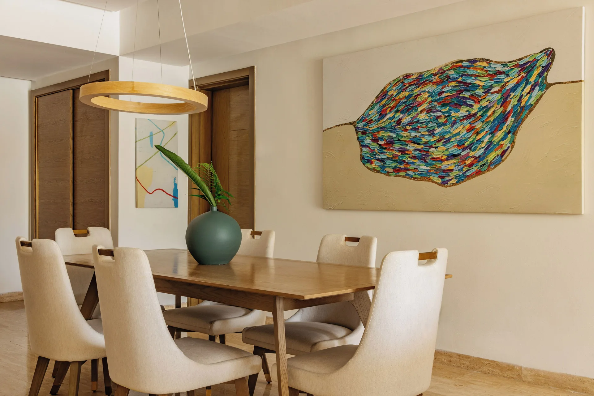 Dining table with six chairs in the Family Concierge Master Suite at Paradisus Grand Cana.
