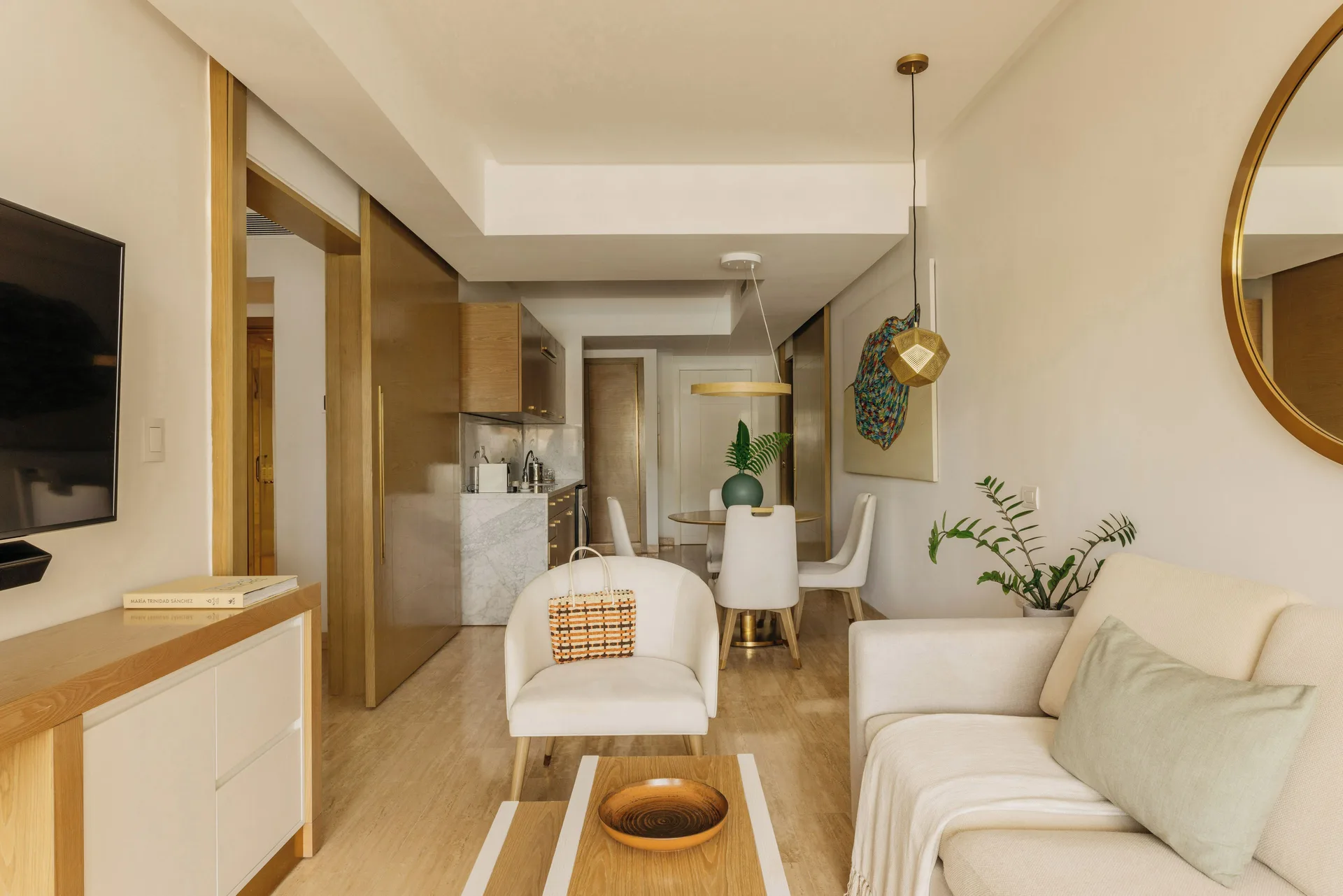 Family Concierge Master Suite living room with sofa and dining area at Paradisus Grand Cana.