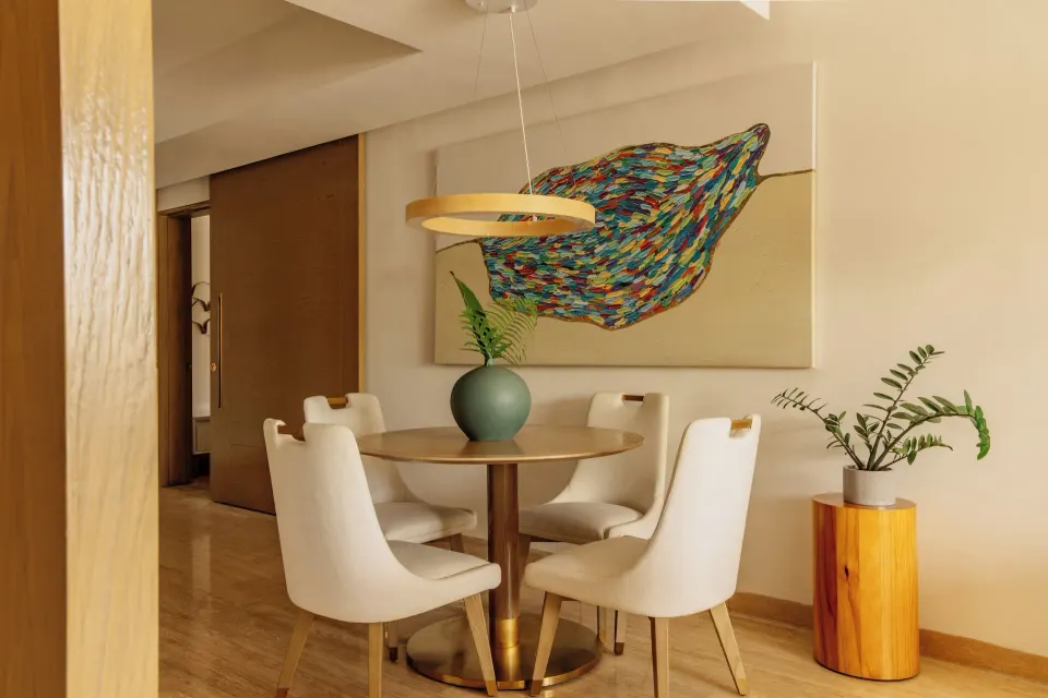 Family Concierge Master Suite round dining table and wall art at Paradisus Grand Cana.
