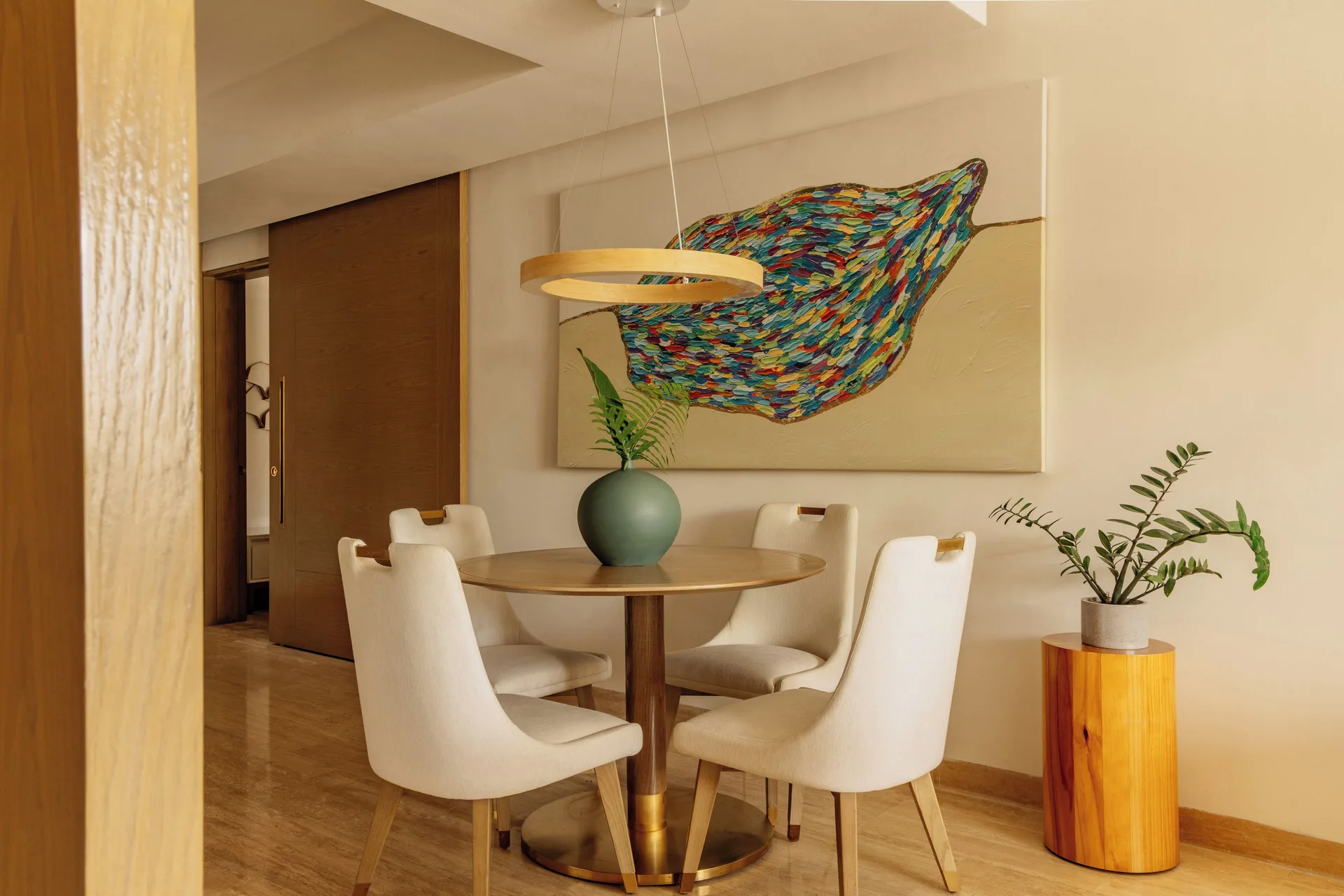 Family Concierge Master Suite round dining table and wall art at Paradisus Grand Cana.