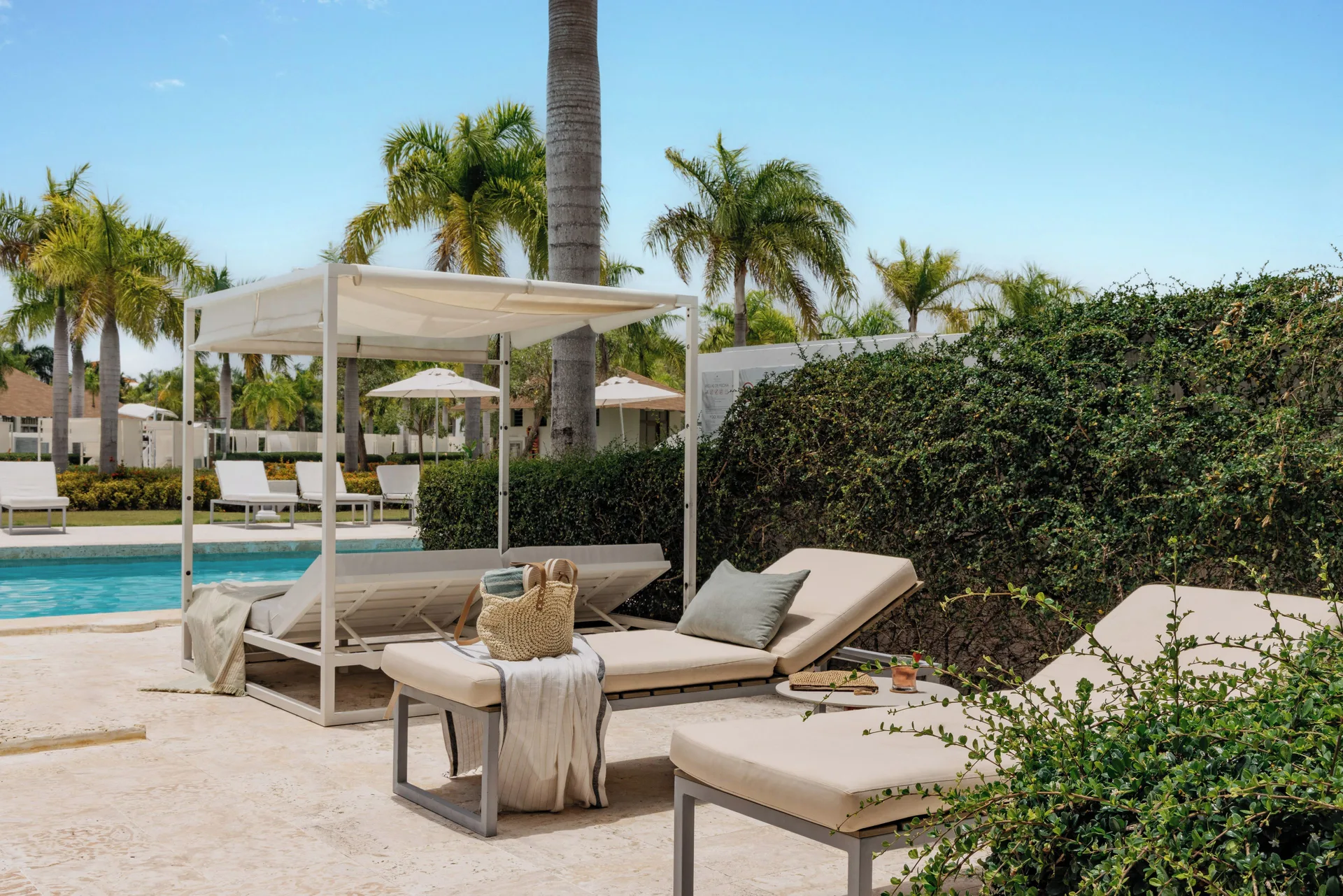 Family Concierge Swim Up Suite terrace with loungers and pool at Paradisus Grand Cana.