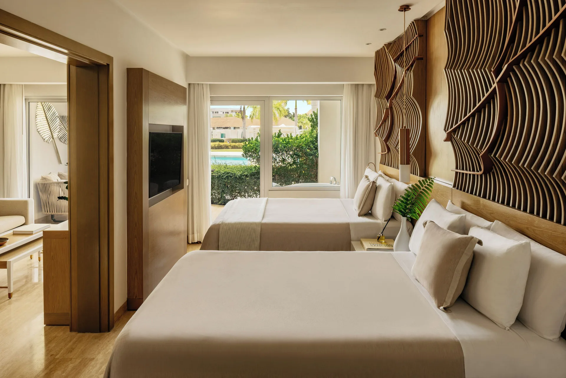 Family Concierge Swim Up Suite bedroom with two beds at Paradisus Grand Cana.