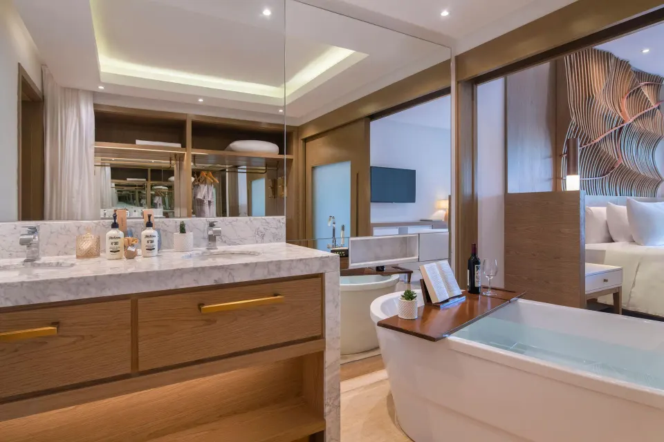 Bathroom with soaking tub and vanity in a suite at Paradisus Grand Cana.