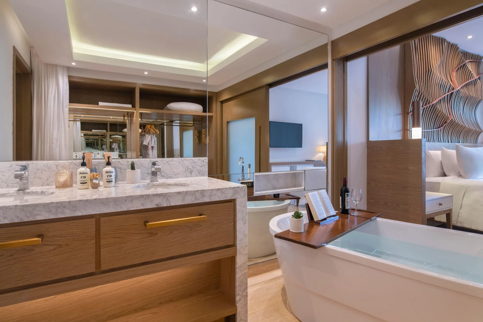 Bathroom with soaking tub and vanity in a suite at Paradisus Grand Cana.