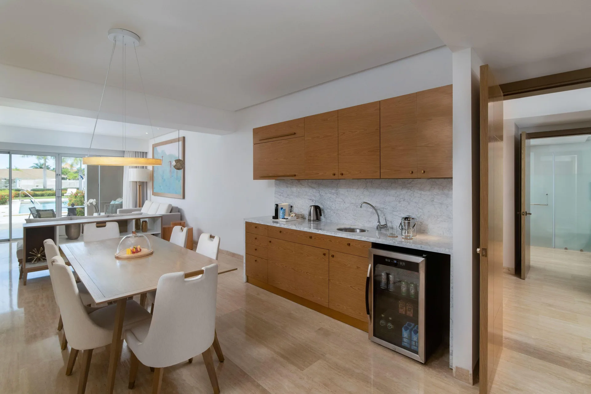 Dining table and kitchenette in a Family Concierge suite at Paradisus Grand Cana.