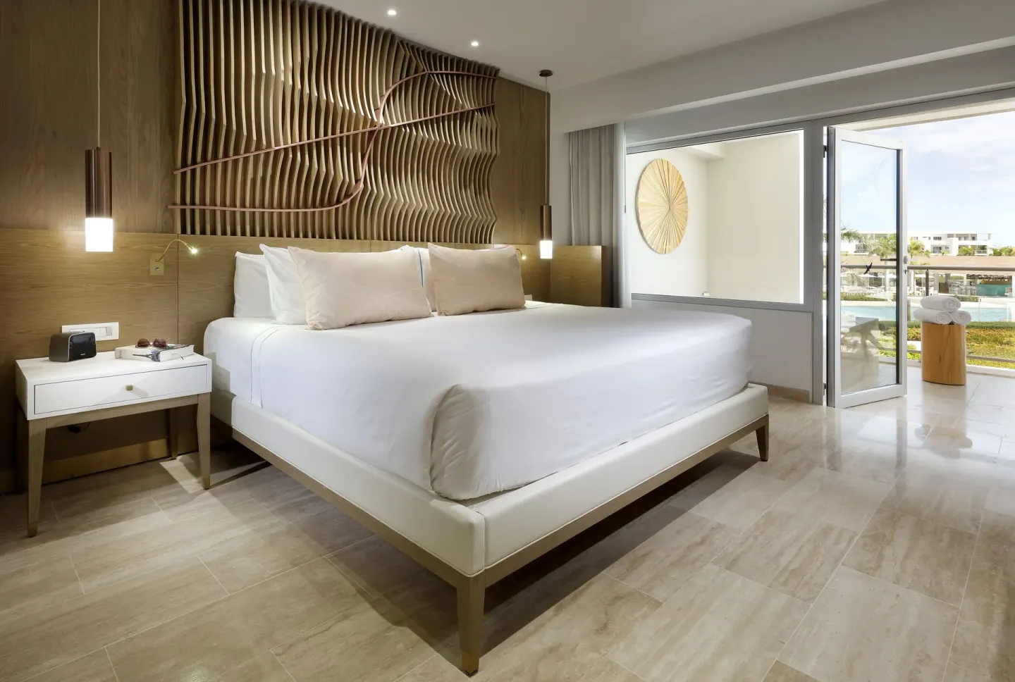 Master Suite bedroom with king bed and balcony at Paradisus Grand Cana.