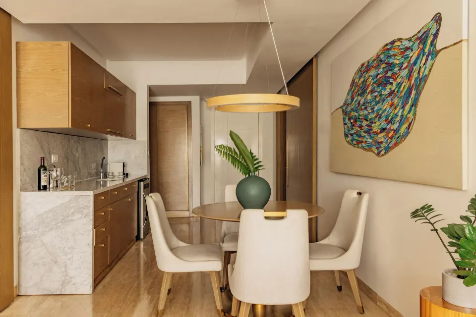 One Bedroom Pool View Suite dining area and kitchenette at Paradisus Grand Cana.