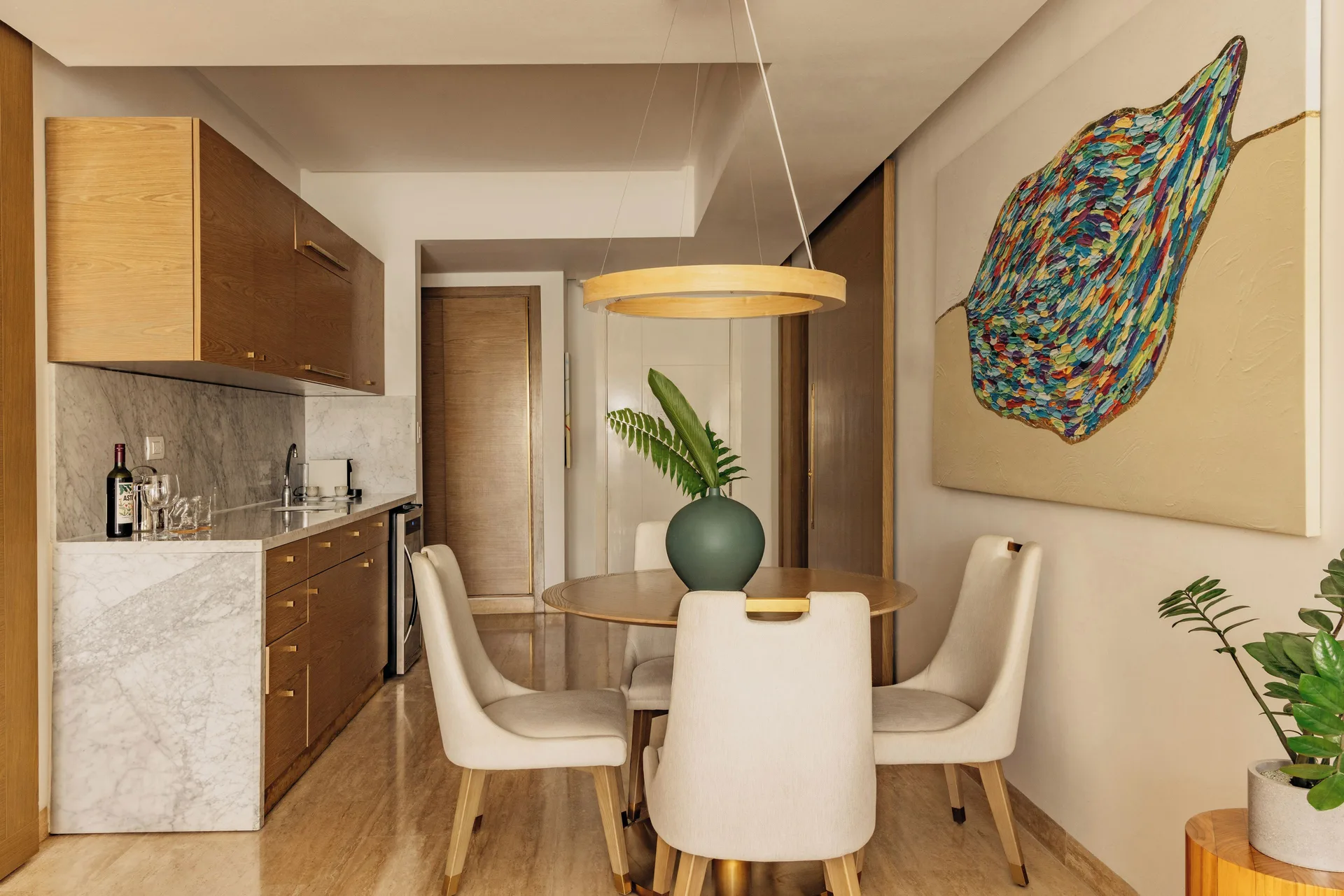 One Bedroom Pool View Suite dining area and kitchenette at Paradisus Grand Cana.