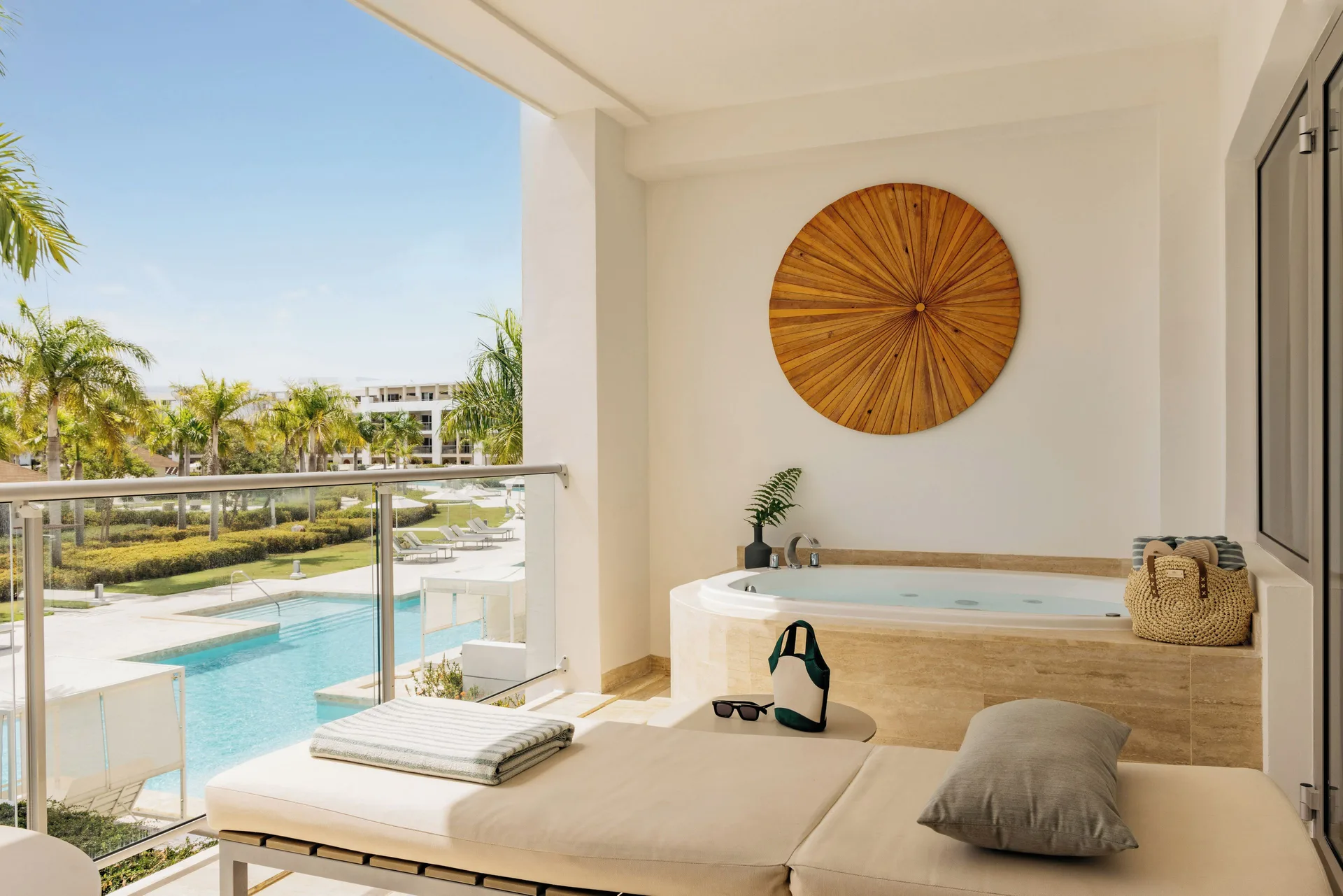One Bedroom Pool View Suite terrace with daybed and whirlpool at Paradisus Grand Cana.