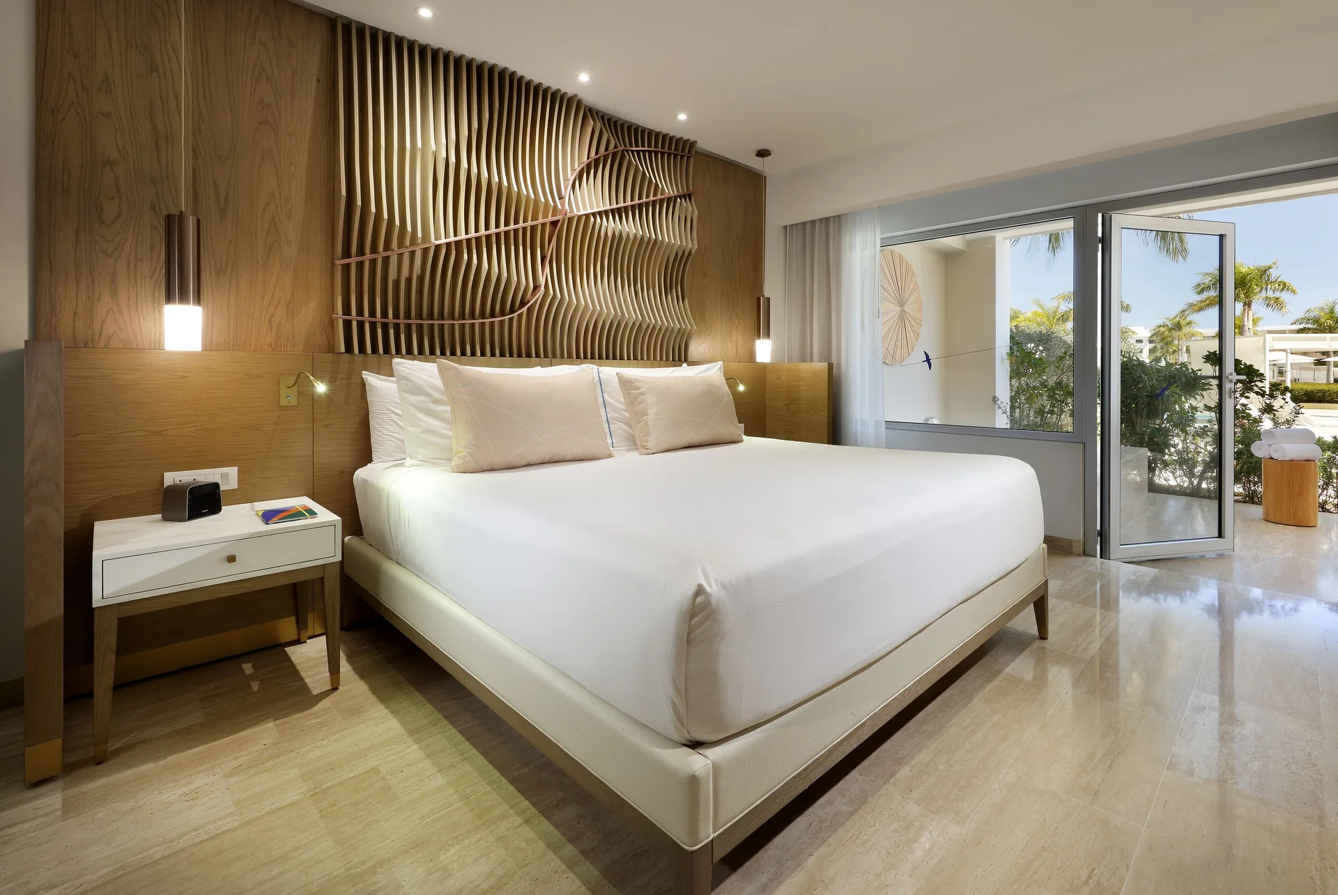 Swim Up Suite king bed at Paradisus Grand Cana with modern décor and direct swim-up pool access.