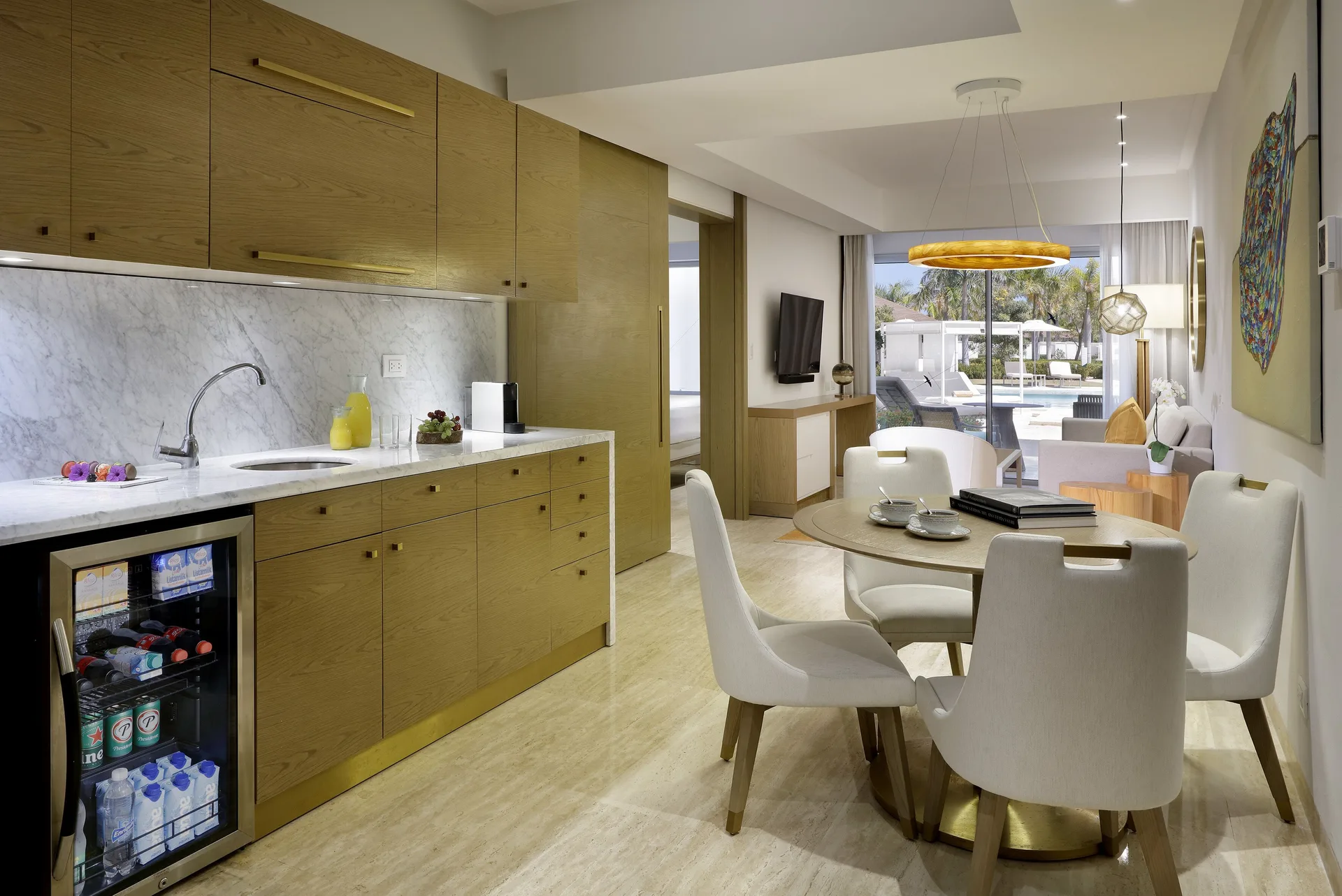 Swim-up suite kitchenette and dining area at Paradisus Grand Cana with patio beyond.