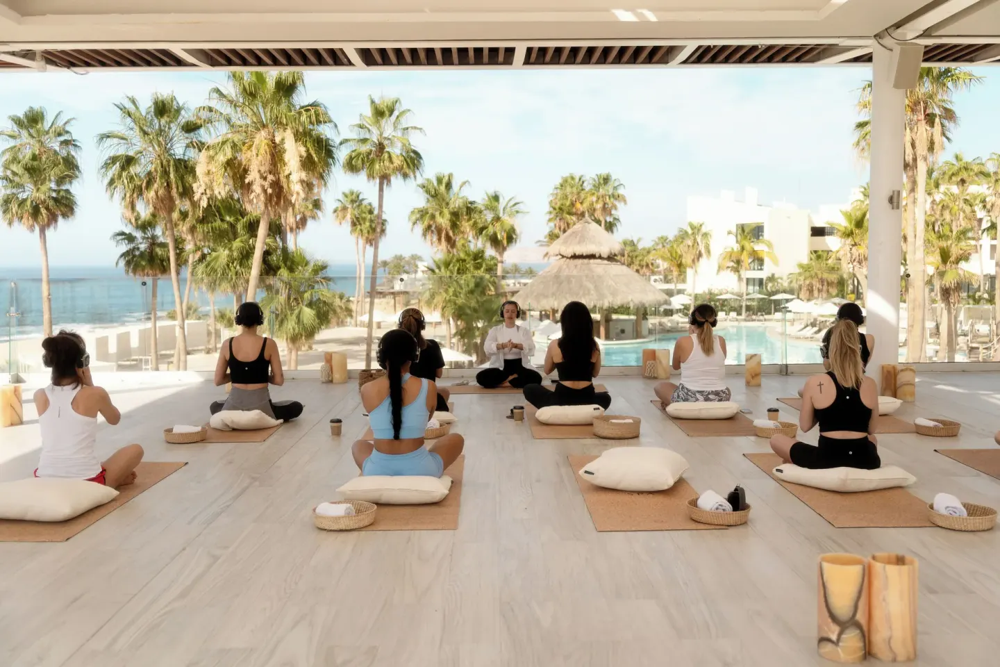 Covered group meditation class overlooking the pool at Paradisus Los Cabos.