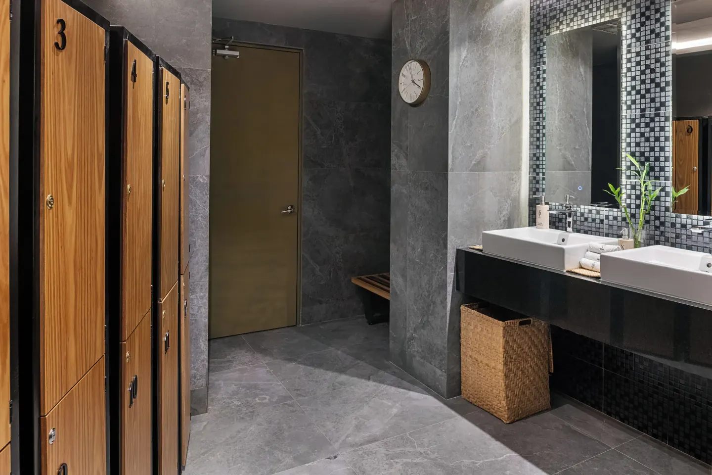 Spa locker room with wood lockers and sinks at Paradisus Los Cabos.