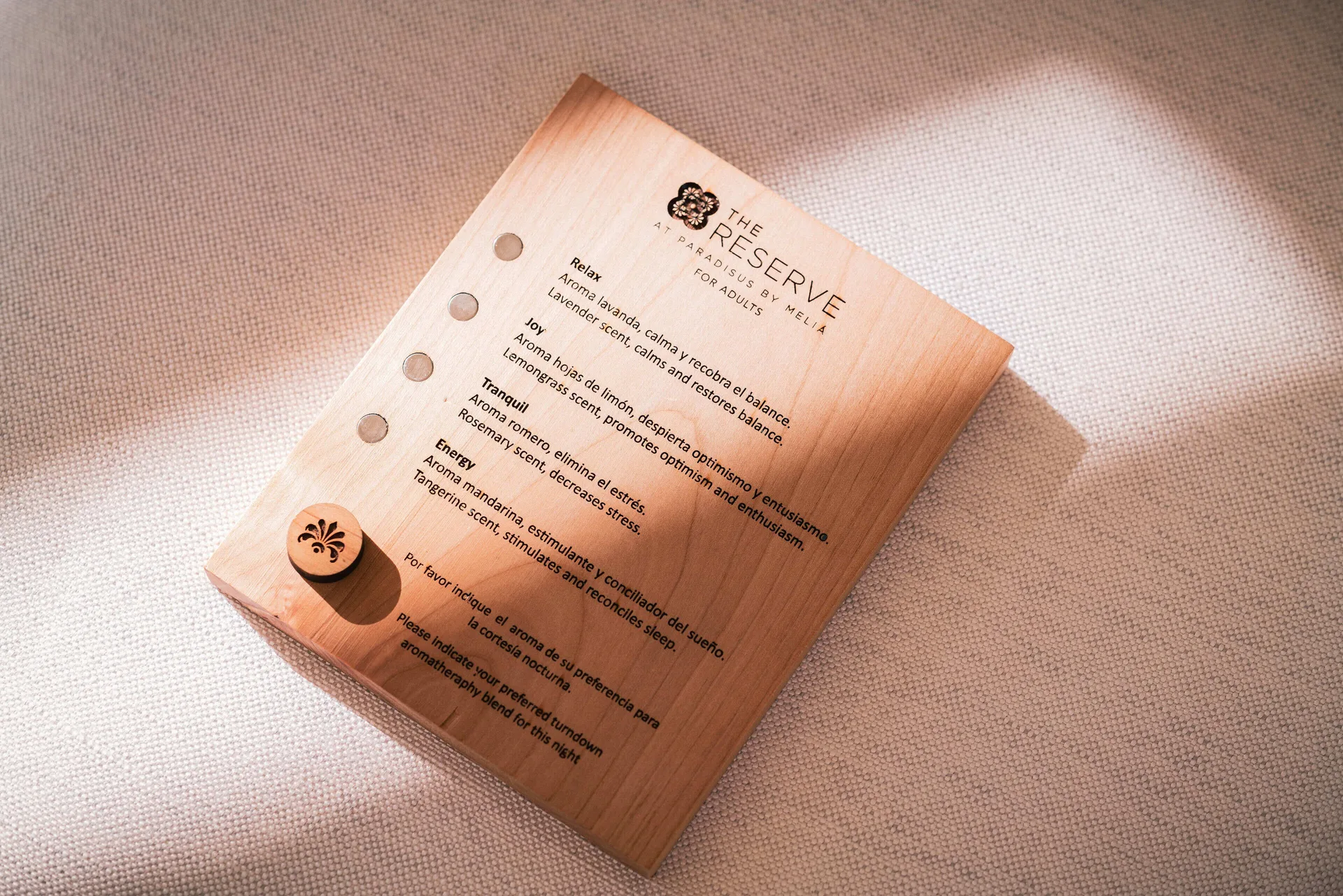 Turndown aromatherapy preference card on a bed at Paradisus Los Cabos.