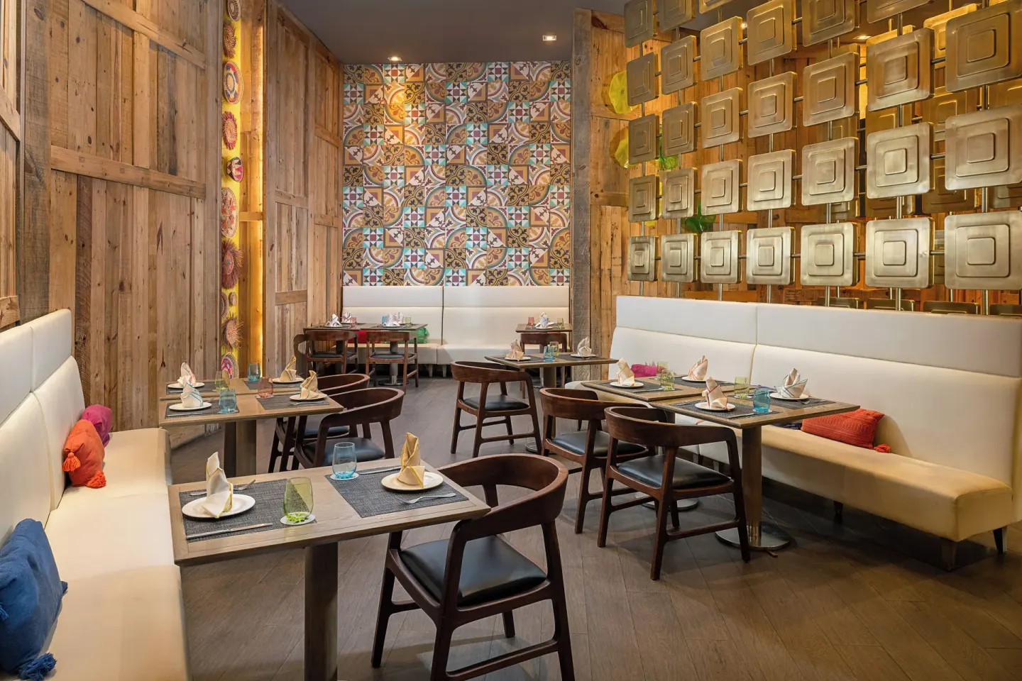 Colorful restaurant dining room with banquettes at Paradisus Los Cabos.