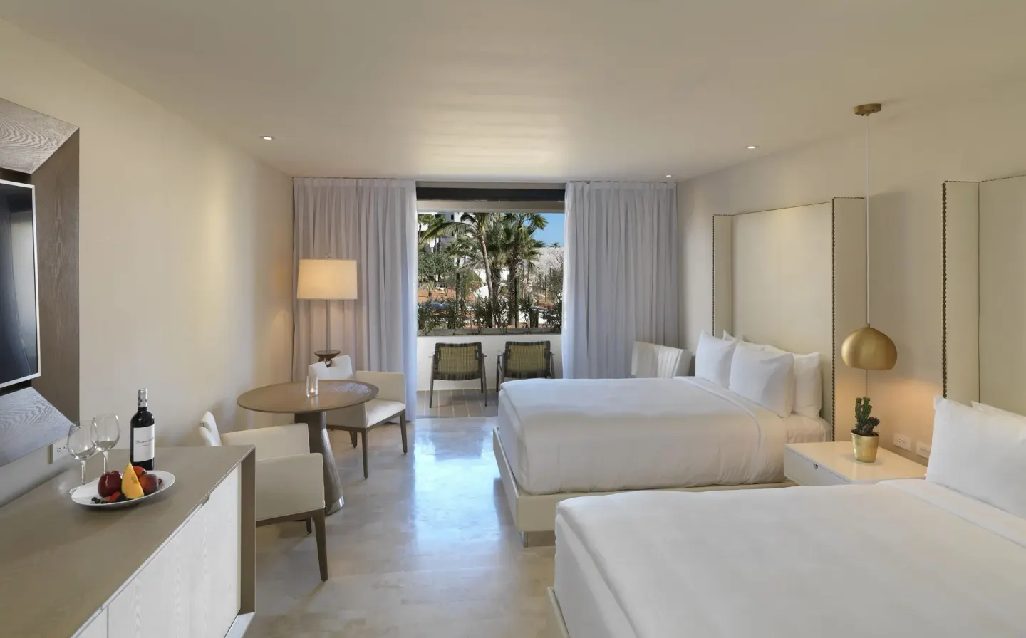 Two-bed Junior Suite with balcony garden view at Paradisus Los Cabos.