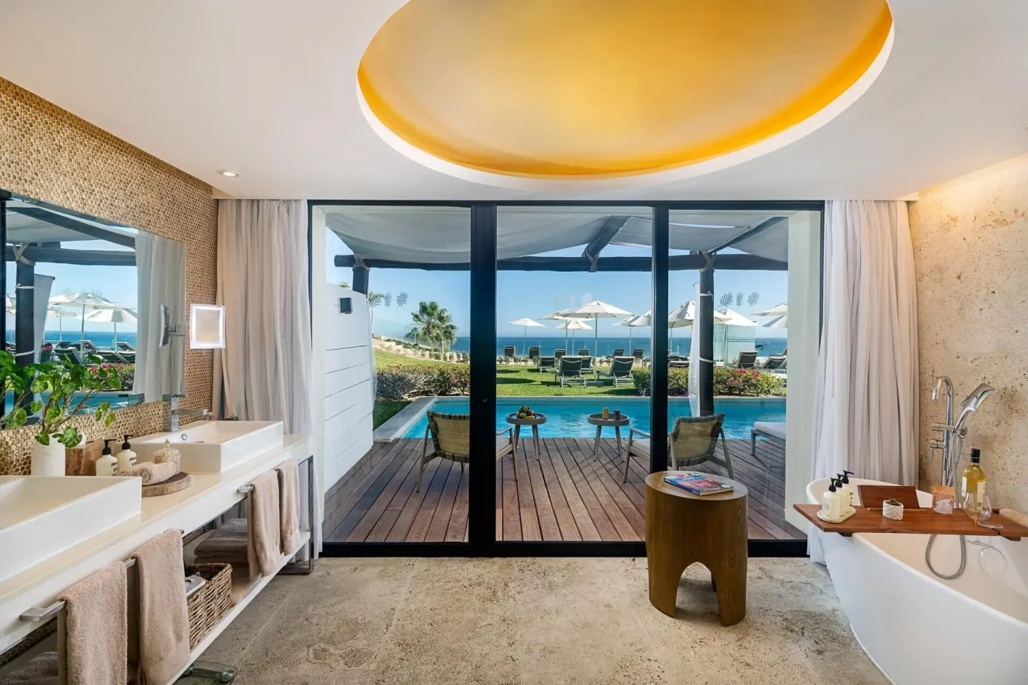 Ocean-front swim-up suite bathroom and terrace at Paradisus Los Cabos.