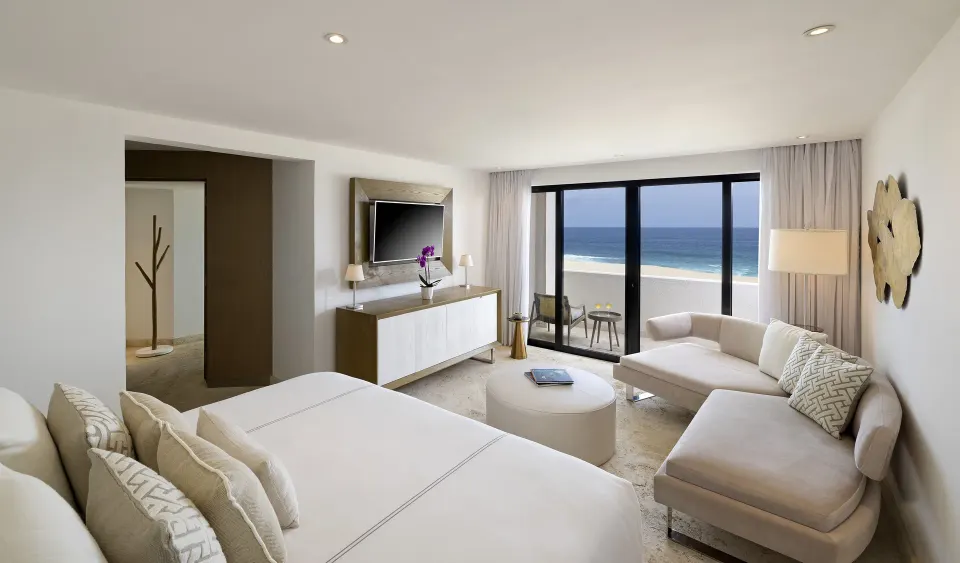The Reserve Master Suite Ocean Front bedroom with king bed and balcony at Paradisus Los Cabos.