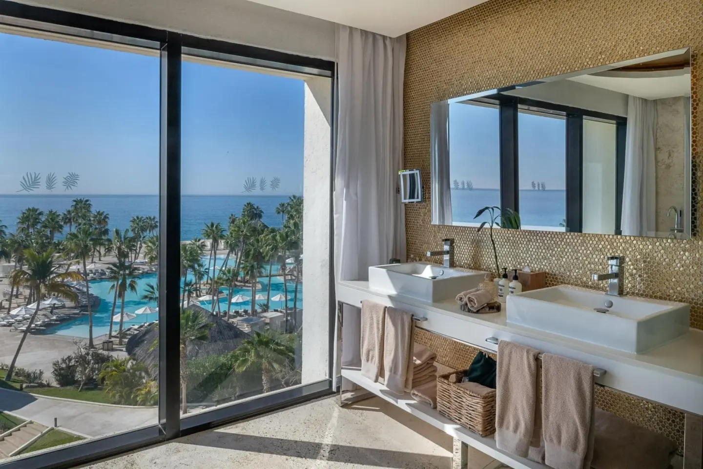 The Reserve Master Suite bathroom at Paradisus Los Cabos with double sinks and ocean-facing windows.