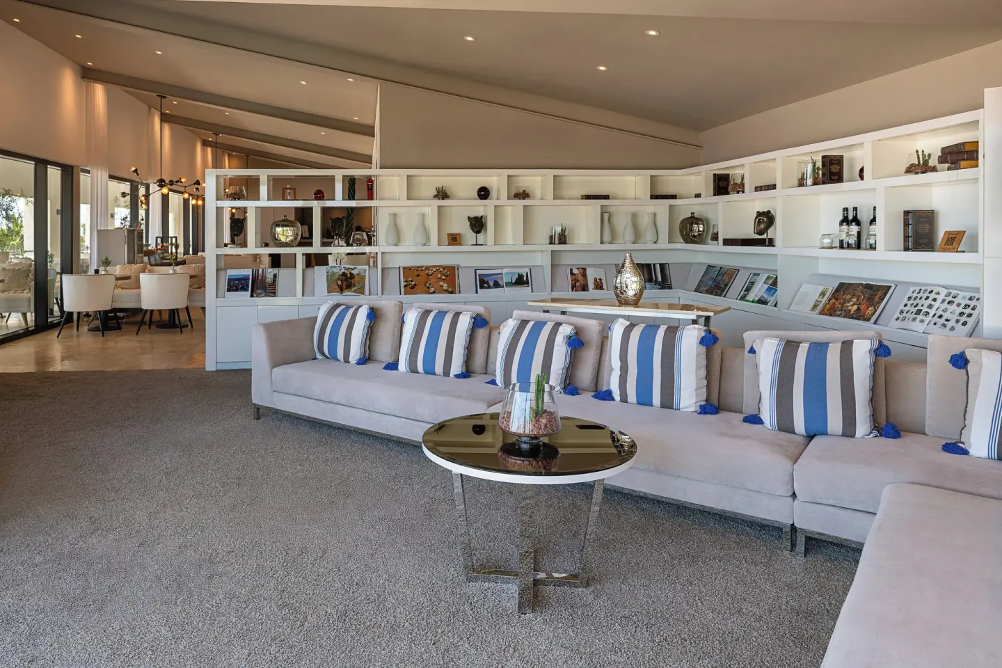Lounge with striped pillows in The Reserve Suite Garden View area at Paradisus Los Cabos.