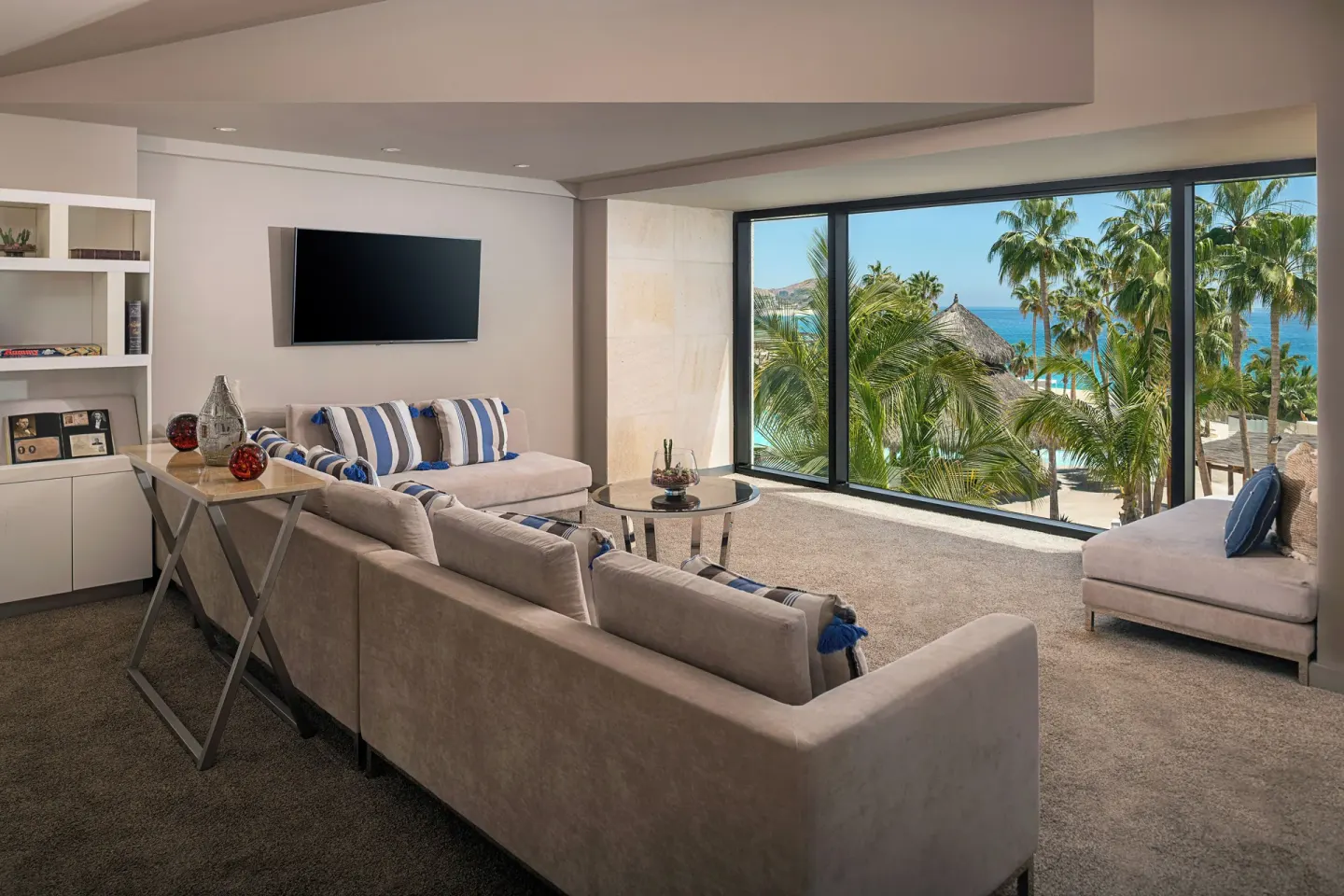 Lounge seating with palm-framed view in The Reserve Suite Garden View area at Paradisus Los Cabos.