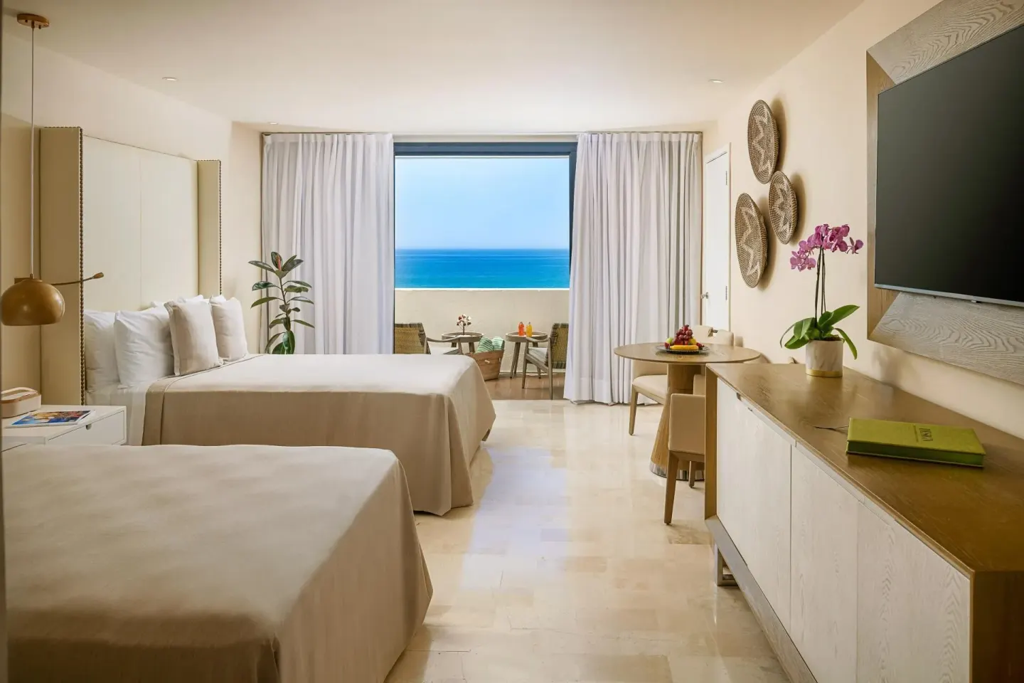 The Reserve Suite Ocean Front room with two beds and sea view at Paradisus Los Cabos.