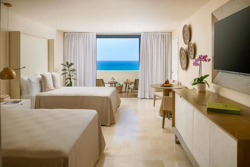 The Reserve Suite Ocean Front room with two beds and sea view at Paradisus Los Cabos.