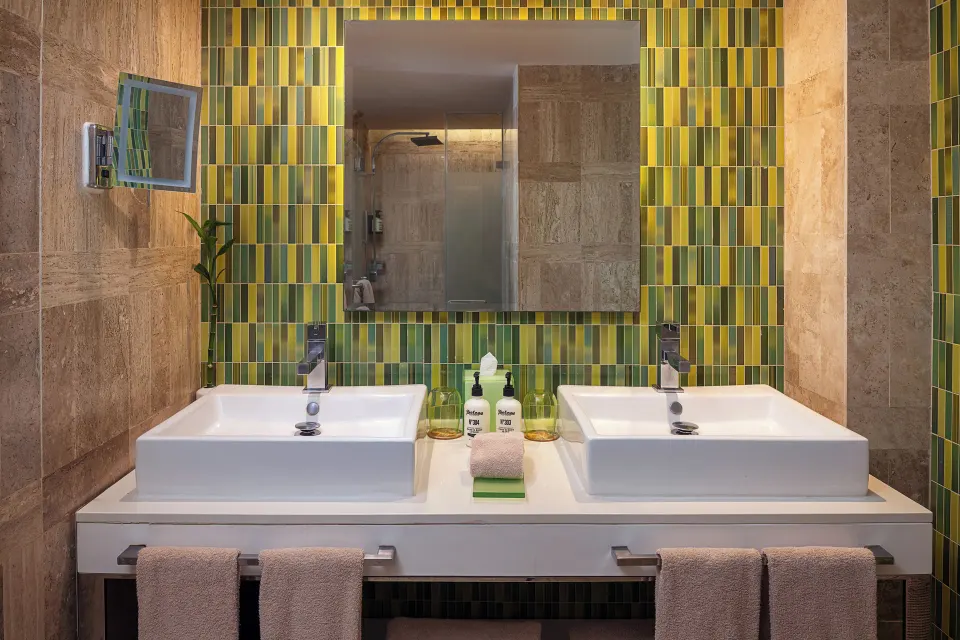 The Reserve Suite Ocean View bathroom with double sinks at Paradisus Los Cabos.