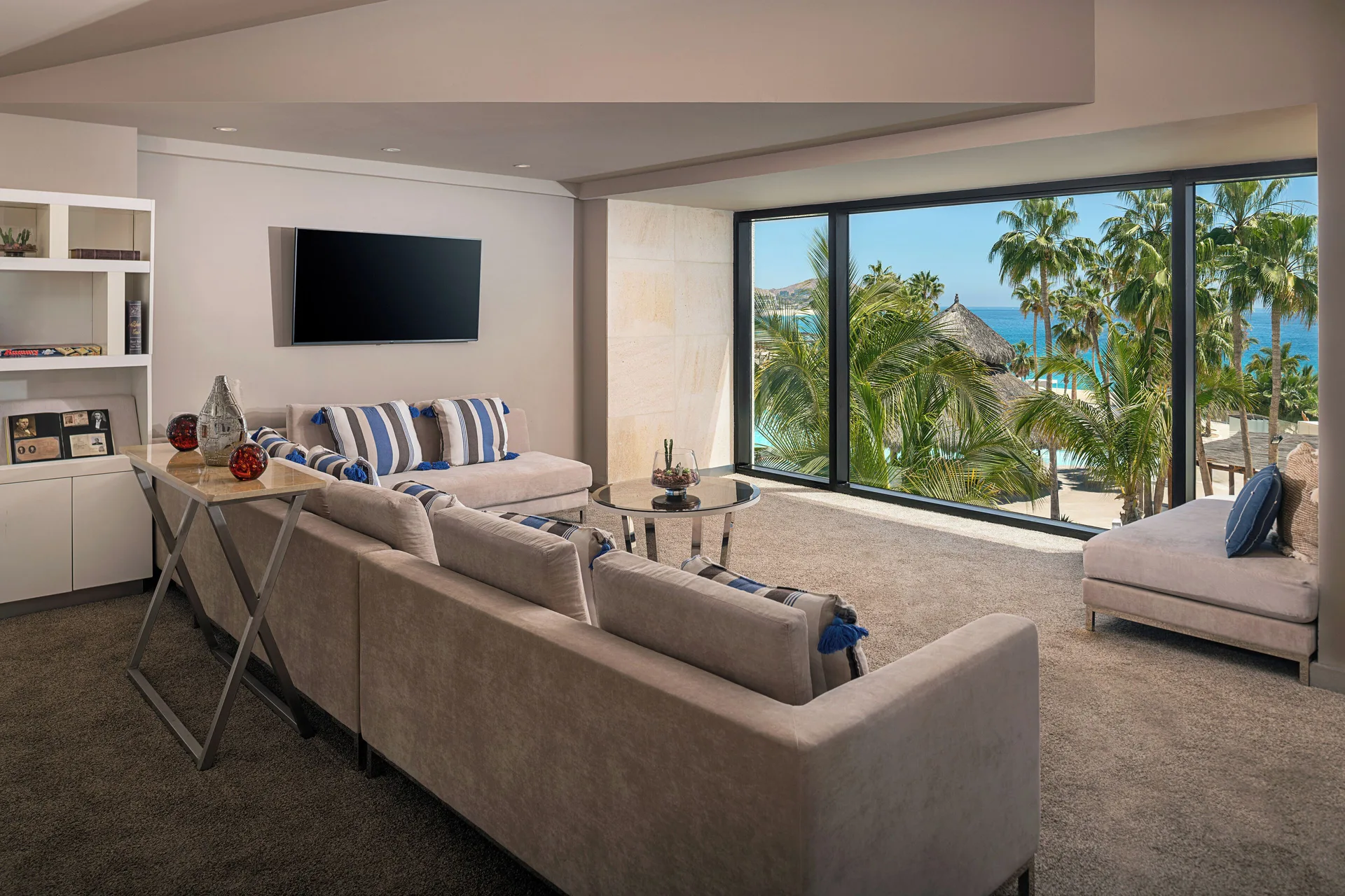The Reserve Suite Ocean View living room with ocean and palms at Paradisus Los Cabos.