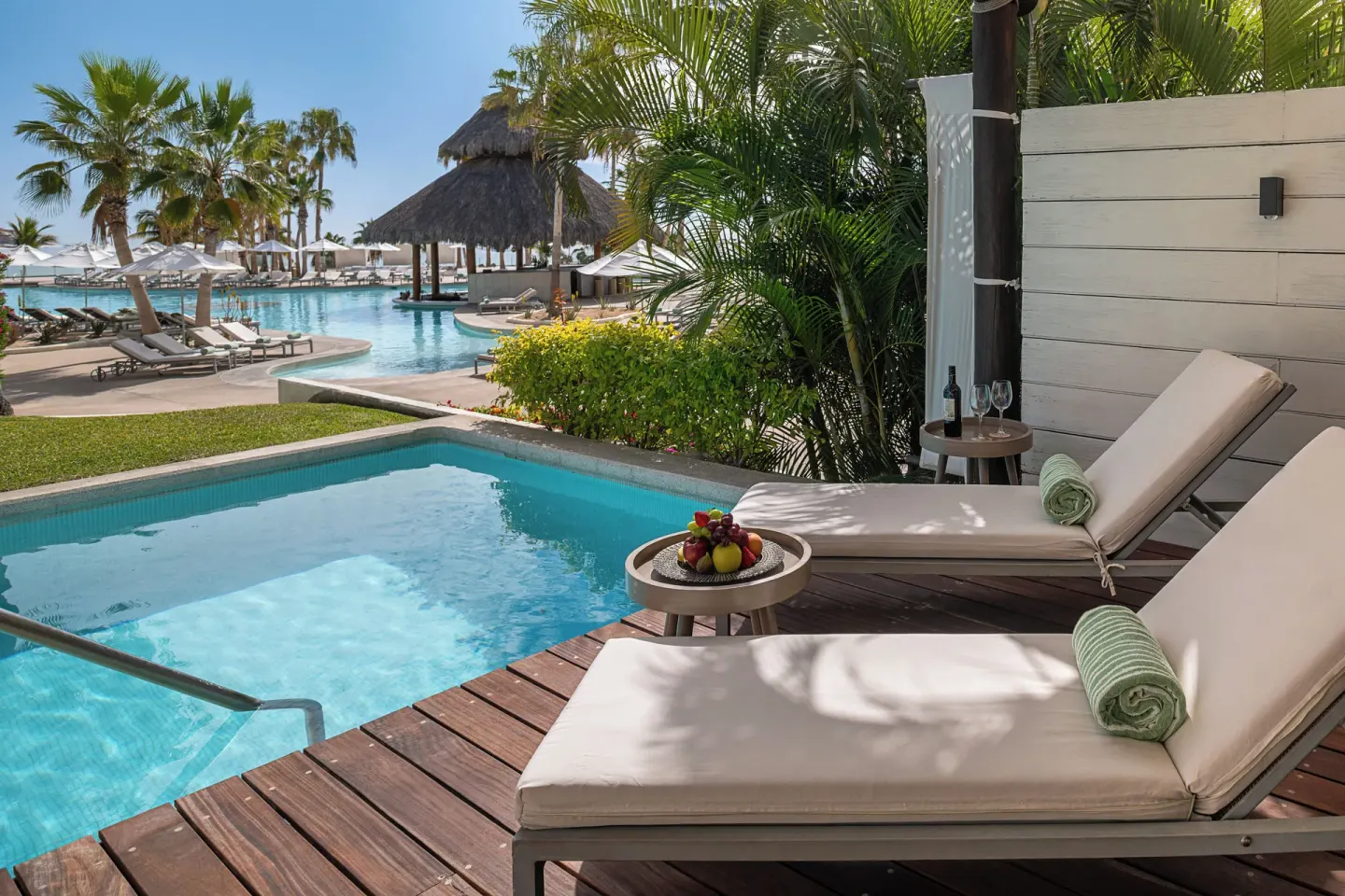 The Reserve Suite Swim-Up terrace with loungers and pool access at Paradisus Los Cabos.