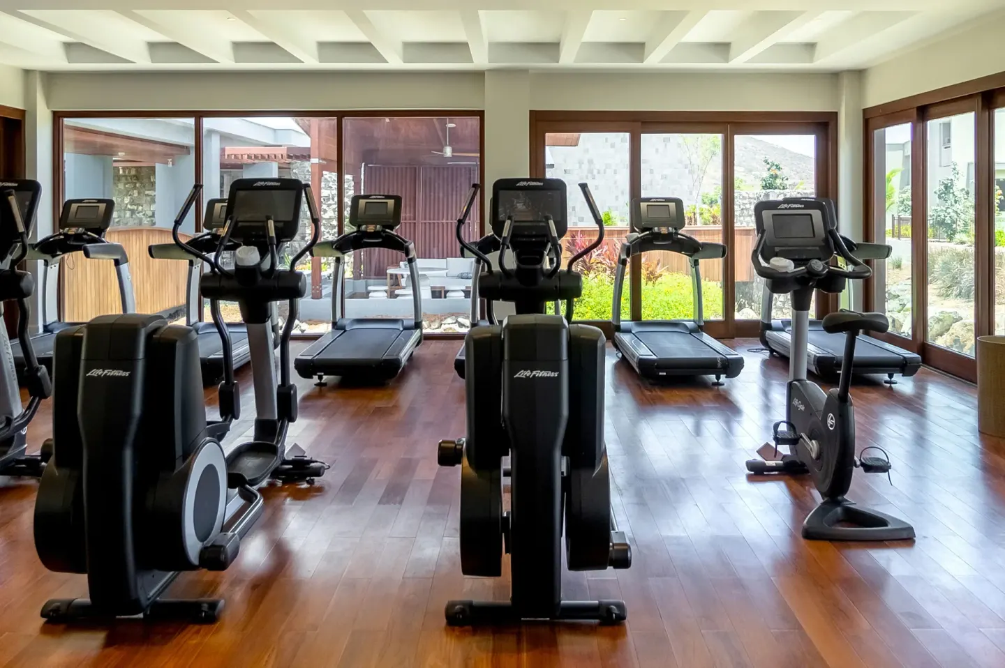 Fitness center with cardio machines and garden views at Park Hyatt St. Kitts.