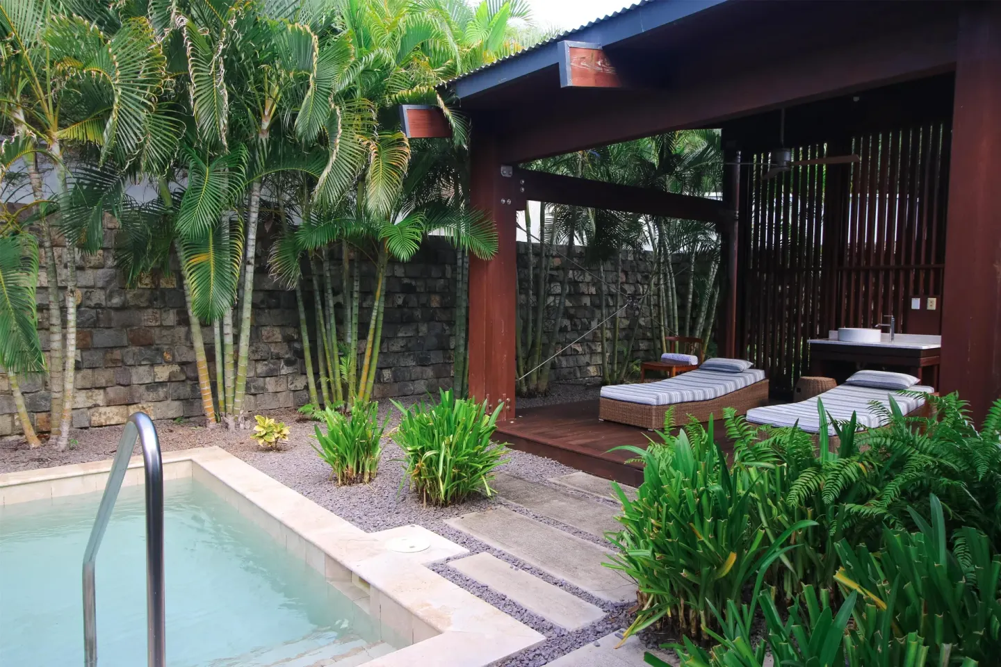 Private plunge pool and shaded loungers in a garden courtyard at Park Hyatt St. Kitts.