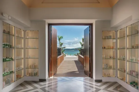 Spa retail displays and open doors to the sea at Park Hyatt St. Kitts.