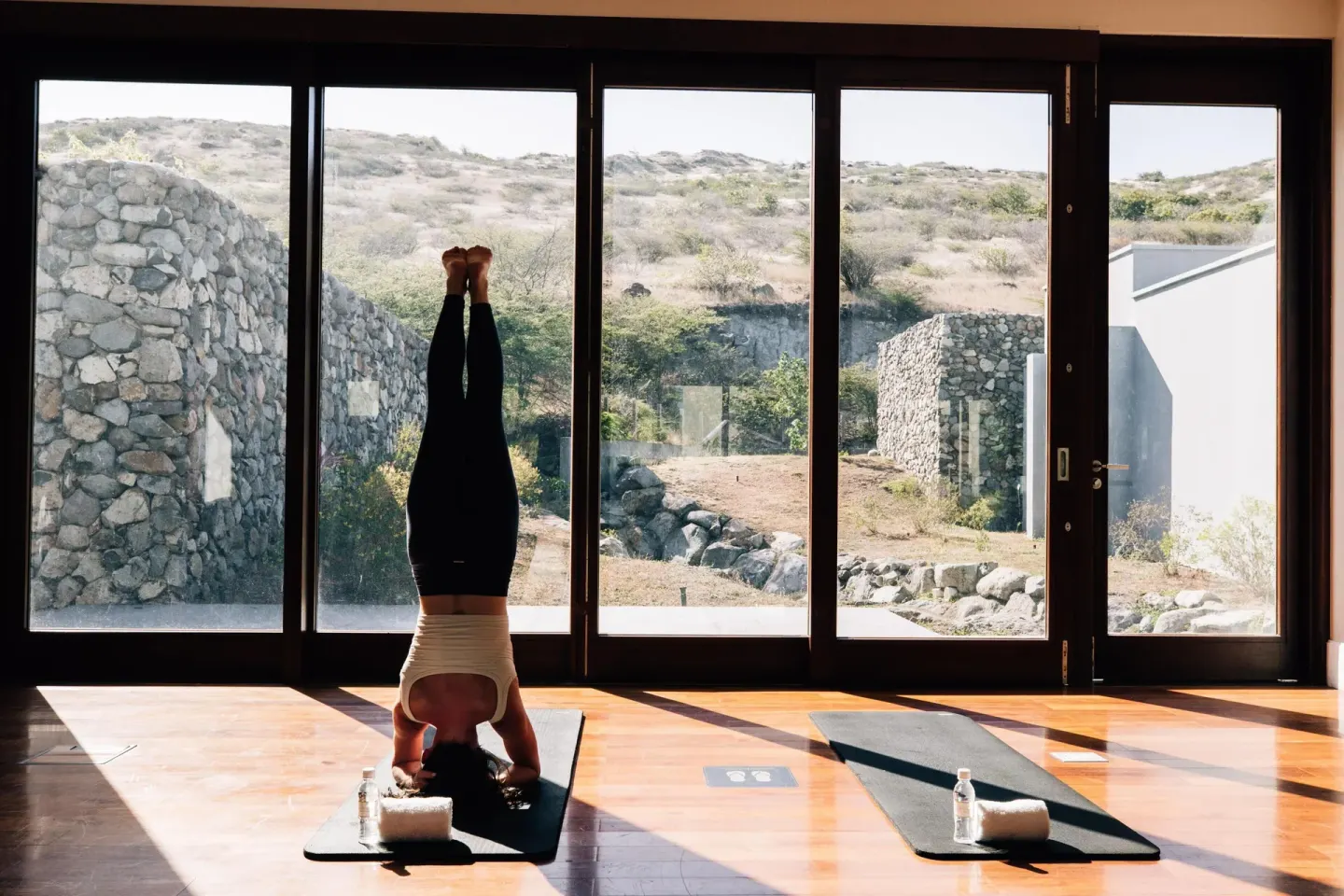 Yoga studio with a guest in a headstand at Park Hyatt St. Kitts.