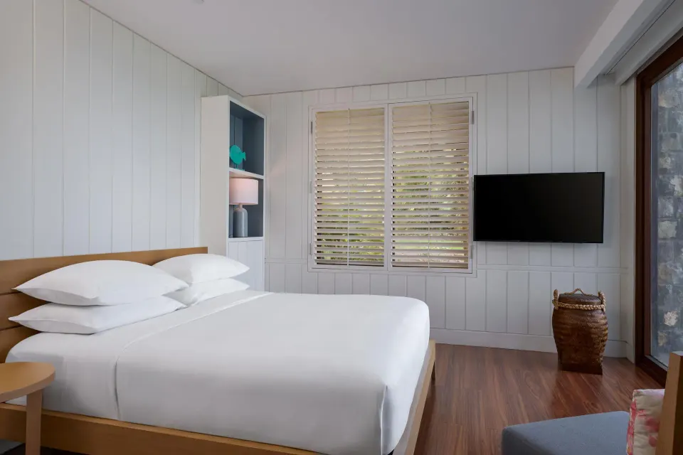 Presidential Villa bedroom with king bed and wall-mounted TV at Park Hyatt St. Kitts.