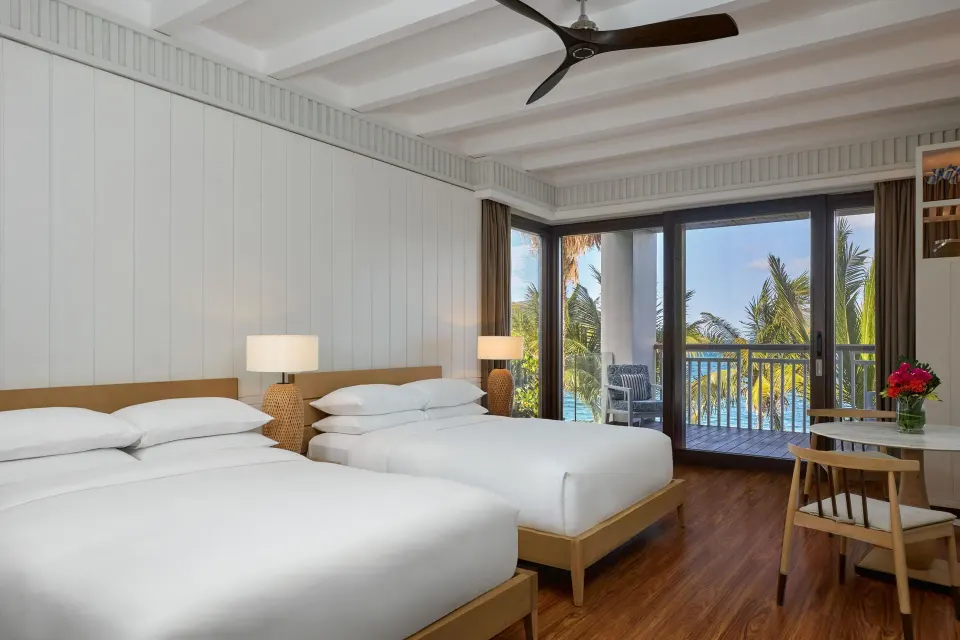 Presidential Villa bedroom with two beds and balcony view at Park Hyatt St. Kitts.