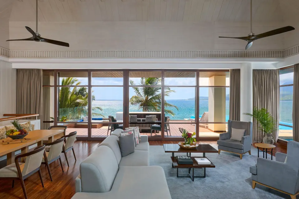 Presidential Villa living room with ocean-facing glass doors at Park Hyatt St. Kitts.