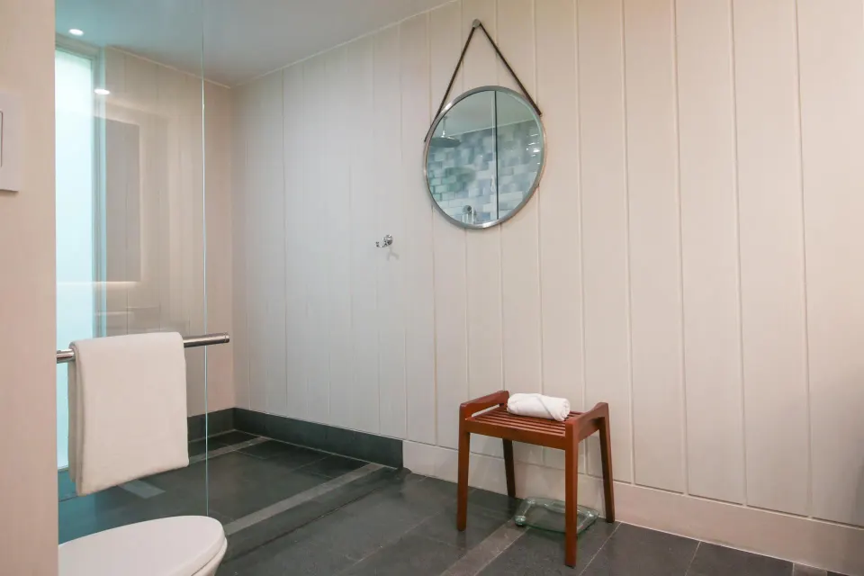 Accessible shower area with bench and towel rail at Park Hyatt St. Kitts.